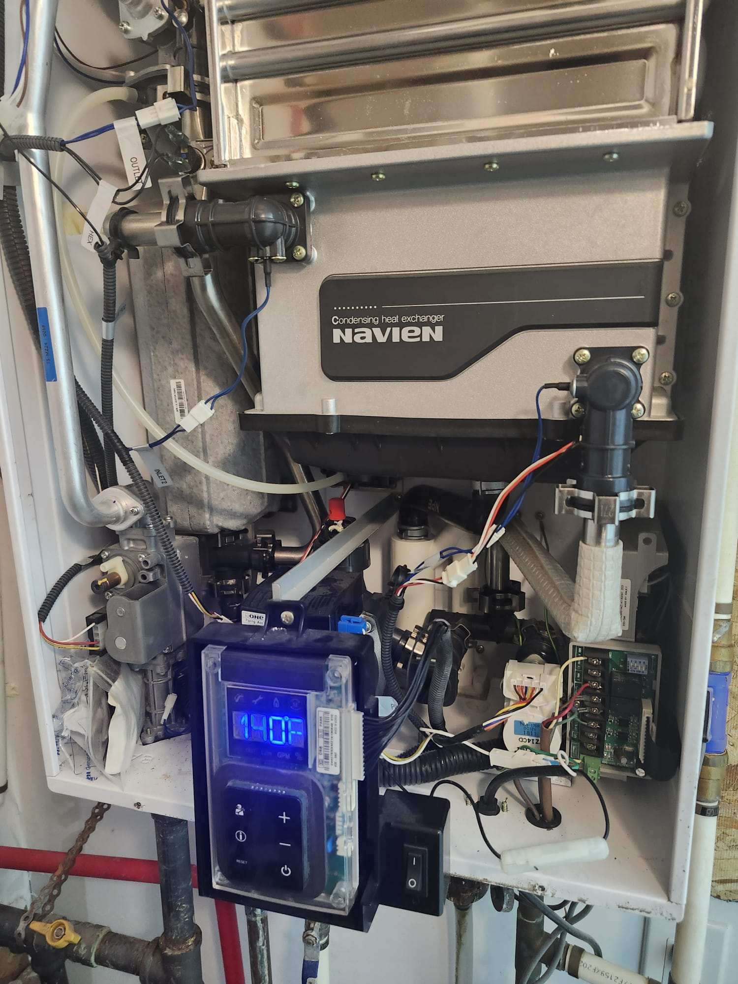 Navien tankless water heater being serviced
